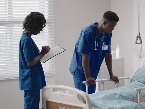 Nurse and doctor with patient