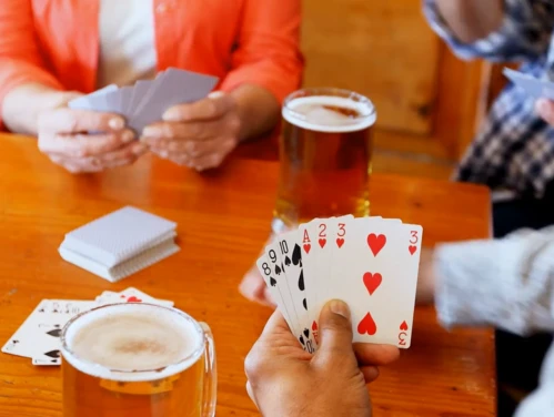 People playing cards in a bar