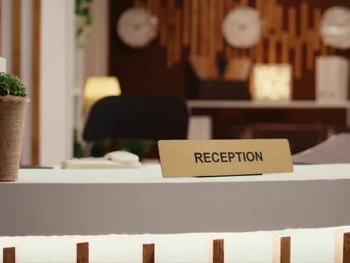 hotel lobby desk with reception sign
