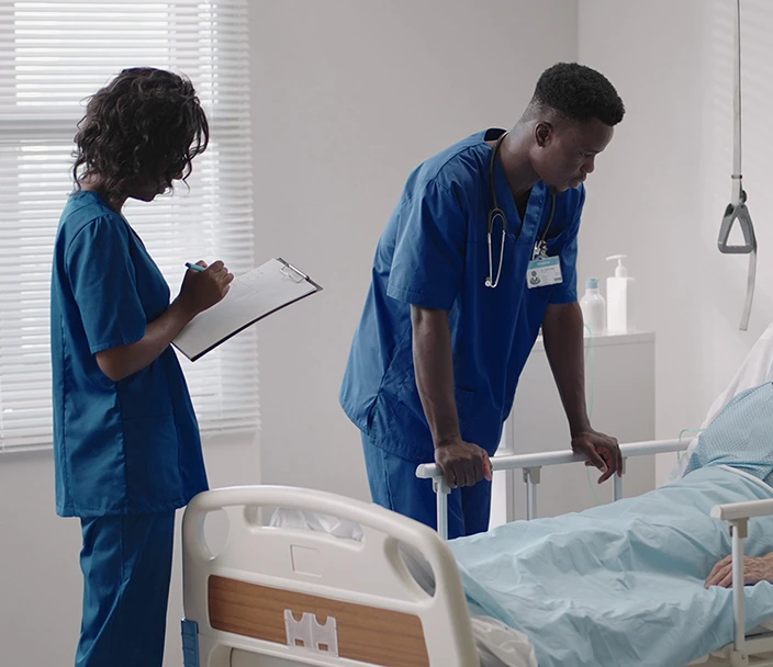 Nurse and doctor with patient