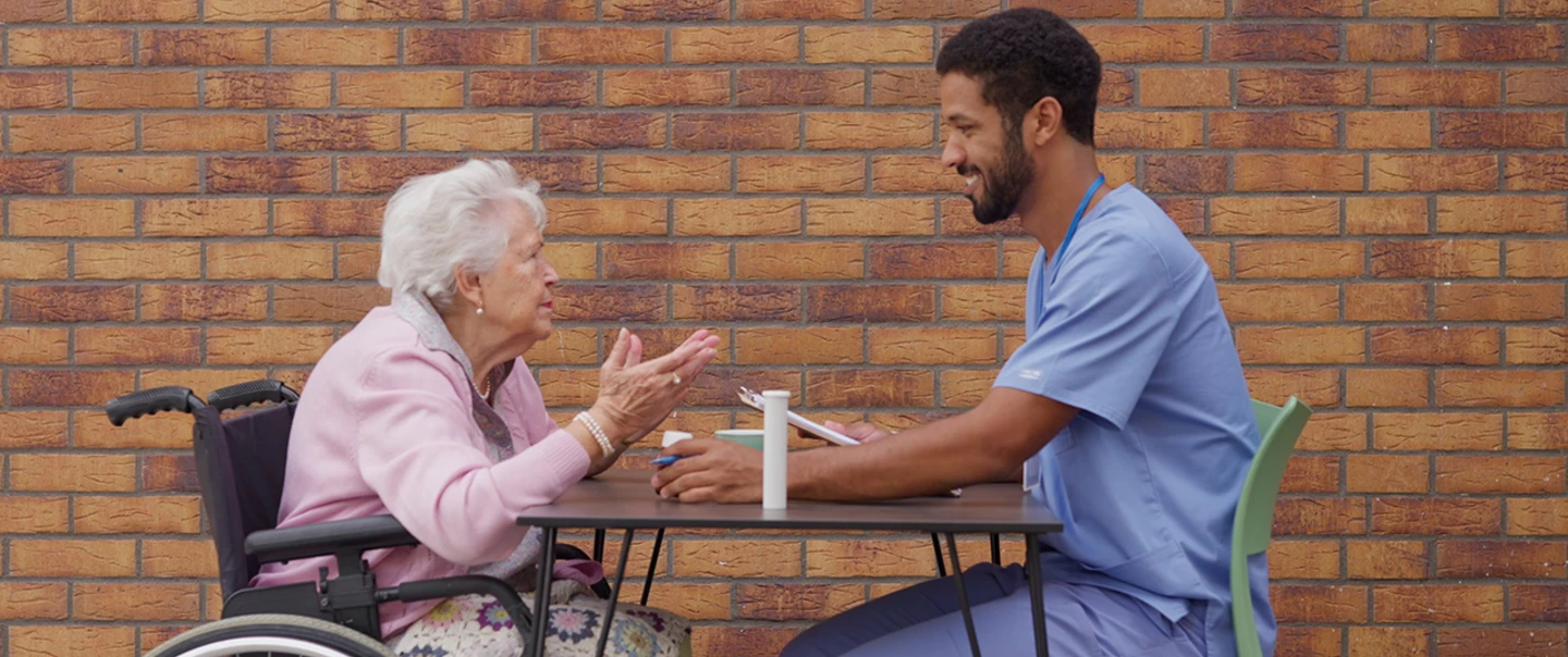 Elderly patient with nursing assistant