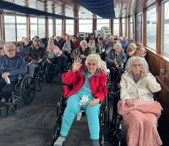 Group of elderly adults riding in a bus